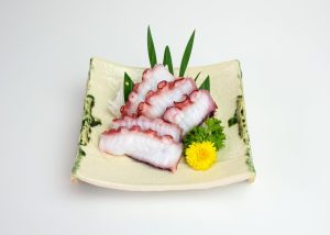 Fresh Tako squid slices of japanese food on ceramic plate